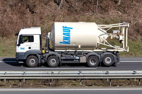 WIEHL, GERMANY - MARCH 24, 2021: Knauf MAN TGS mortar silo transporting truck on motorway.
