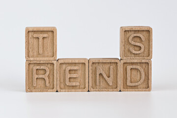 photo on trends theme. wooden cubes with the word "trends", on white background