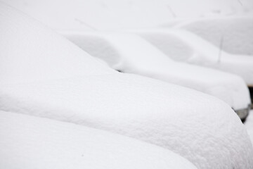 Fototapeta na wymiar Image of several cars under snow