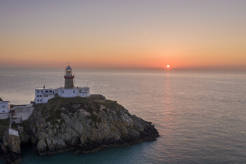 Aerial view of Howth Lighthouse at sunrise, beautiful Irish coastline Lighthouse.