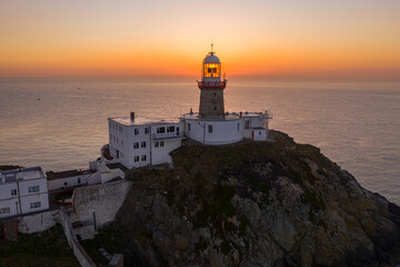 Fototapeta na wymiar Aerial view of Howth Lighthouse at sunrise, beautiful Irish coastline Lighthouse.