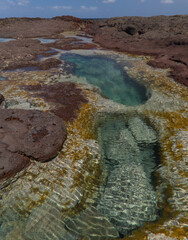Gran Canaria, calm natural seawater pools in under the steep cliffs of the north coast and separated from the ocean by volcanic rocks,
Sardina del Norte area