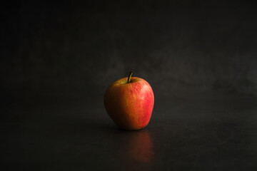 fresh red apple on dark background