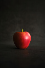 fresh red apple on dark background
