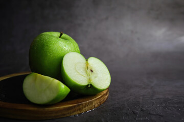 green apple on the black background