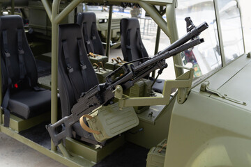 A large machine gun mounted on a military vehicle. Modern weapons of light artillery. Close-up. No people