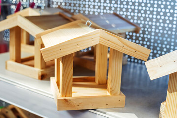 Wooden feeders for wild birds on the counter in the store. Close-up
