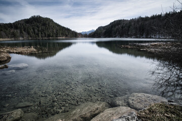 lake and mountains with reflections of the trees forrest