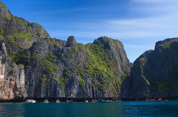 Tropical sea and rocks over turquoise water on Phi Phi island in Southern Thailand. Beautiful Maya bay in lovely sunny day
