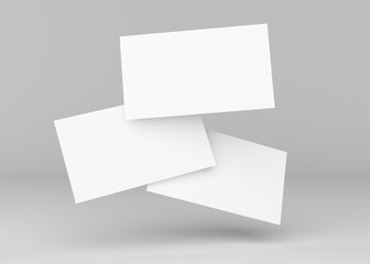 Mockup horizontal business cards on gray background background. Three business cards on a light...