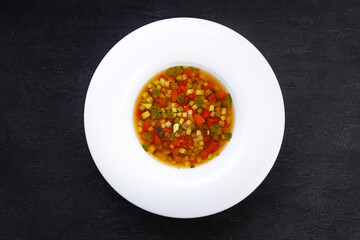 Minestrone Italian soup in a plate, top view