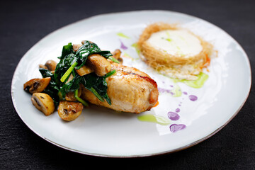 Chicken breasts with cheese and vegetable garnish
