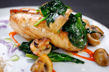 Chicken breasts with cheese and vegetable garnish