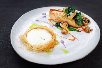 Chicken breasts with cheese and vegetable garnish