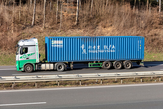 WIEHL, GERMANY - MARCH 24, 2021: EKB Container Logistik Mercedes-Benz Actros truck with Yuxinou container on motorway.