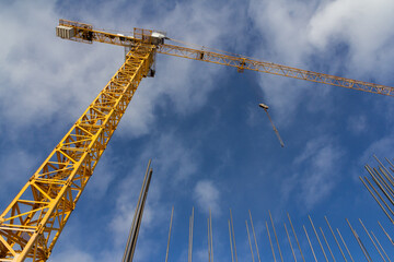 Tower crane against the blue sky. Construction equipment