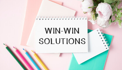 Win-Win solutions - lettering on paper on the desktop, notepad, pen and keyboard. Concept photo of the advantage.