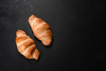 Fresh crisp delicious French croissant with a cup of fragrant coffee