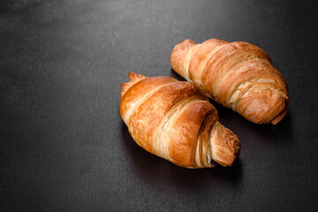 Fresh crisp delicious French croissant with a cup of fragrant coffee