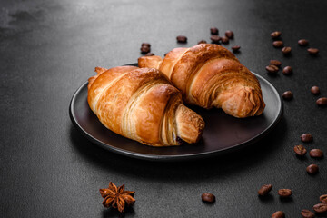 Fresh crisp delicious French croissant with a cup of fragrant coffee