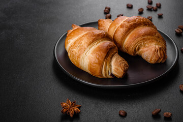 Fresh crisp delicious French croissant with a cup of fragrant coffee