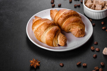 Fresh crisp delicious French croissant with a cup of fragrant coffee
