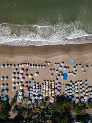 aerial view on the beach and sun umbrellas in the morning