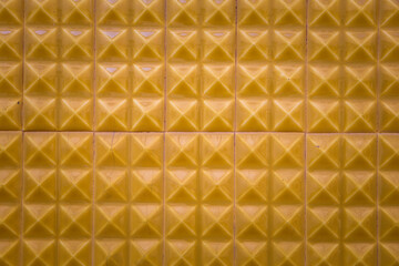 Yellow color ceramic texture detail of wall. 