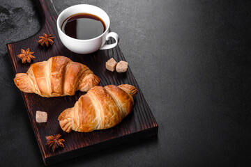 Fresh crisp delicious French croissant with a cup of fragrant coffee
