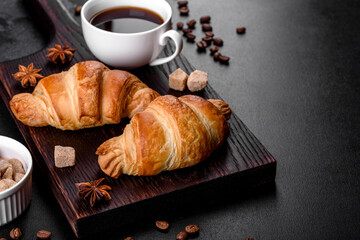 Fresh crisp delicious French croissant with a cup of fragrant coffee