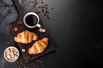 Fresh crisp delicious French croissant with a cup of fragrant coffee