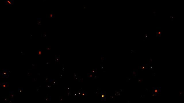 Fire sparks floating burst explosion loop overlay Slow Motion. Sparks flying up isolated on black