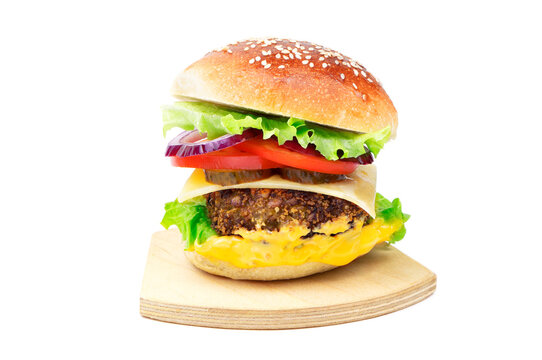 Cheeseburger on a cutting board isolated on a white background. Hamburger with cheese. Burger isolated