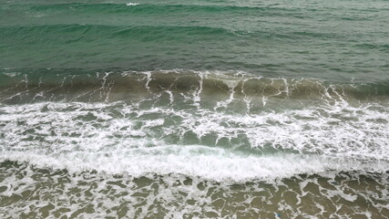 Waves on the shore. Storm on the Mediterranean Sea. Turquoise sea