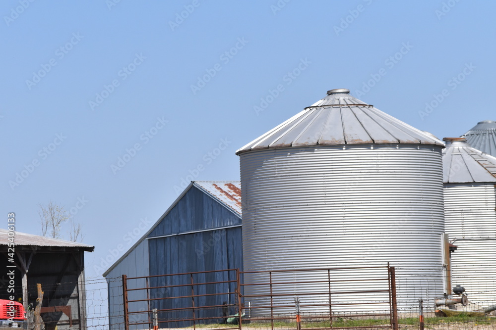 Wall mural grain bins by a barn