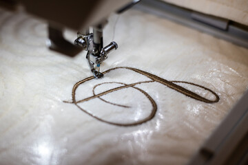 Embroidery design, alphabet D monogram. Machine Embroidery on a cotton towel with brown thread....