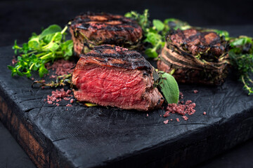 Traditional barbecue dry aged angus medaillon beef filet steak natural with herbs and chili served...