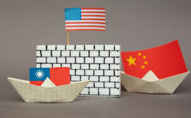 paper ship with national flag of China and Taiwan and Usa, concept of border conflict, independence and freedom shipment or free trade agreement, confrontation