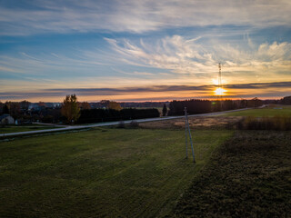 Drone photo of empty road leading through the rural village