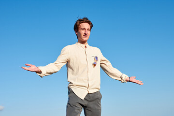 A Caucasian man from Spain acting confused and surprised on clear sky background