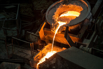 Tank pours liquid metal at the steel mill