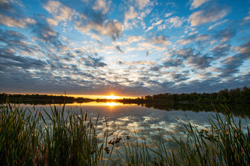 Fototapeta na wymiar The lake is like a mirror reflecting the sky.