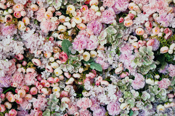 Delicious aroma of flowering in spring and summer. Banner texture bouquet of different petals of flora plants. The flowers of roses, peonies, carnations are very much the sea. Copy space.