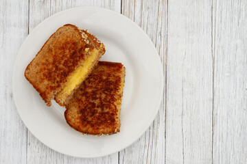 Grilled cheese whole wheat sandwich on a plate