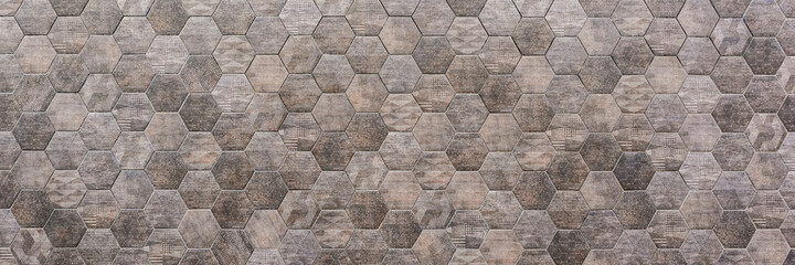Hexagonal tile wall, gray hexagonal tile, outdoor wall, space for text. Panorama