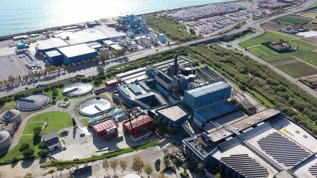 Aerial view of industrial facilities of Mataro factory producing detergent and air fresheners, Costa del Maresme, Spain