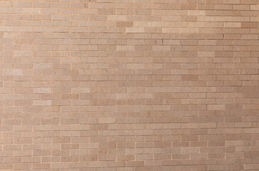 Tan brick texture pattern taken during the day