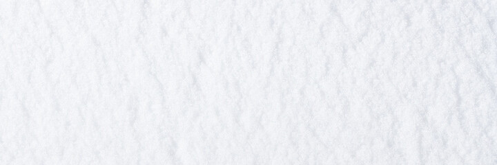 Natural snow texture. Smooth surface of clean fresh snow. Snowy ground. Winter background with snow patterns. Perfect for Christmas and New Year design. Closeup top view.