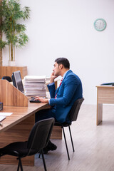 Young businessman employee working in the office