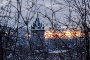 Chapelle at sunset through the trees